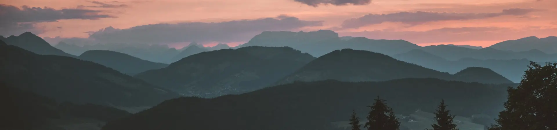 A view of mountains with the sky in the background.